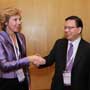 Connie Hedegaard, European Commissioner for Climate Action is greeted by Anthony Cheung, Hong Kong Consumer Council Chairman at the Consumers International World Congress