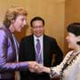 Connie Hedegaard, European Commissioner for Climate Action is greeted by Connie Lau, Chief Executive of Hong Kong Consumer Council at the Consumers International World Congress