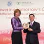 Connie Hedegaard, European Commissioner for Climate Action receives a souvenir from Anthony Cheung, Hong Kong Consumer Council Chairman at the Consumers International World Congress