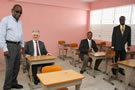May 2010 Ambassador Marco Mazzocchi Alemanni and General Manager of Technical Services at JSIF Omar Sweeney try out desks and chairs in a new classroom block at the Maverley Primary and Junior High in St. Andrew. The construction was funded through the EU's Poverty Reduction Programme