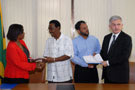 Jamaica &ndash; June 2010 Representatives of the Wynter's Pen community (centre) receive copies of their grant under the Poverty Reduction Programme (PRP II) to fund projects being implemented by Community Based Organisations in volatile areas. Presenting the grant contracts are Managing Director of Jamaica Social Investment Fund, Miss Scarlett Gillings, CD (left) and Head of the Delegation of the European Union, Ambassador Marco Mazzocchi Alemanni (right).