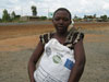 Seed recipient at Lisasadzi, Kasungu, Malawi, shows her bag of seed.