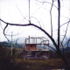 Empty shells that were once homes line the roads in the region of Tuzla. Looters have taken everything they could find, even building materials. September 2003.