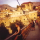 Mostar at the end of the day, on the footbridge that was built next to the construction site of the old bridge. August 2003.