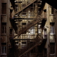The inhabitants of the roofs rarely meet the ones of the buildings. They must take the service stairs, as in this building in Garden City. It gives witness to two worlds who live together without mixing.
