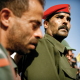 A soldier at the funeral of one of his comrades in arms.