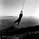 On &lsquo;TV hill&rsquo;, one of the hills overlooking Kabul, a boy swings from the dangling electric wires of a pylon destroyed by the war.