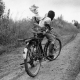 A child soldier rides back to his base in Ituri Province, Eastern Congo.