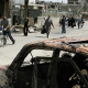 Nahr el Bared, 22 May 2007. Palestinian refugees crossing to safety from the southern entrance of the besieged camp. The refugees fled the battered camp by foot, in cars or pickup trucks when the guns fell silent after three days of ferocious fighting.