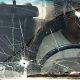 Nahr el Bared, 26 May 2007. A Palestinian man drives his bullet-struck car out of the besieged camp.