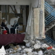 Women sit to talk inside their destroyed house, in the rubble of Jenin refugee camp.
