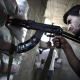Fearing more clashes, young Fatah gunmen of the El Jorf family take position on the roof of their home in Gaza, May 26, 2006.