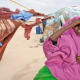 A young Somali woman comes out of her provisionally built shelter. Her house, on the Somali coast in the Haafun area, was destroyed by the tsunami.