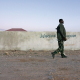 An armed Somali man from the local militia is, under the orders of the police of Puntland, patrolling the Haafun village, on the Somali coast.