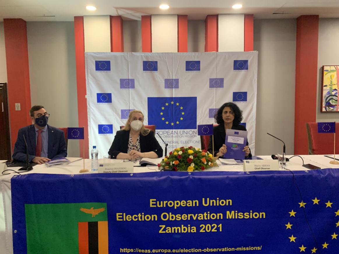 holding up report during press conference. European Union Election Observation Mission Zambia 2021 