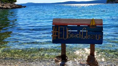 #EUBeachCleanup banner with sea in background