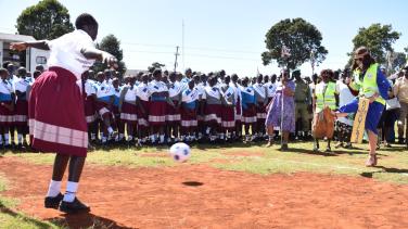 EU Ambassador Henriette Geiger kicks the ball to signify kicking FGM out of Elgeyo Marakwet
