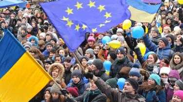  Students wave Ukrainian and European Union flags on December 5, 2013