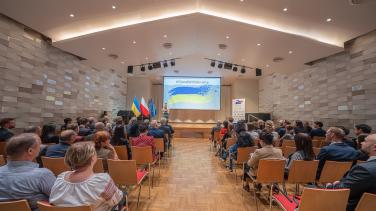 wide shot of film screening room with people sitting