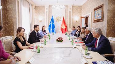 President of Montenegro, Jakov Milatovic sitting with the Ambassador Sattler and Antonio Costa