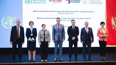 Officials standing on stage