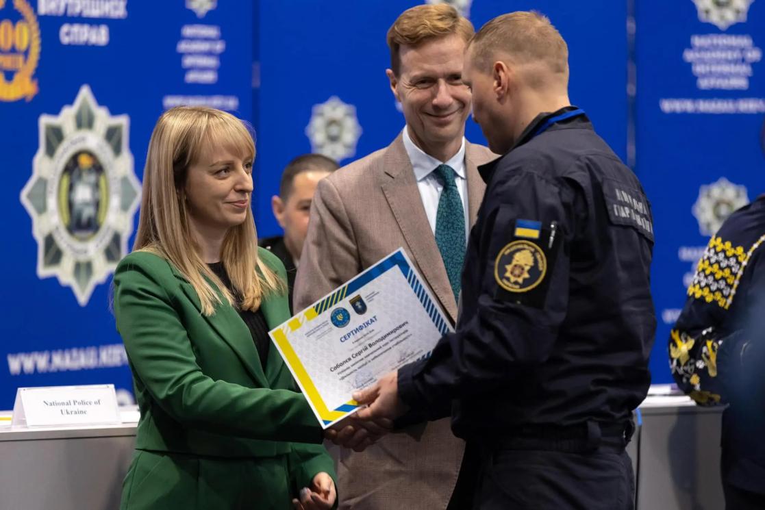 Kateryna Pavlichenko, Deputy Minister of Internal Affairs, presents participants with certificates