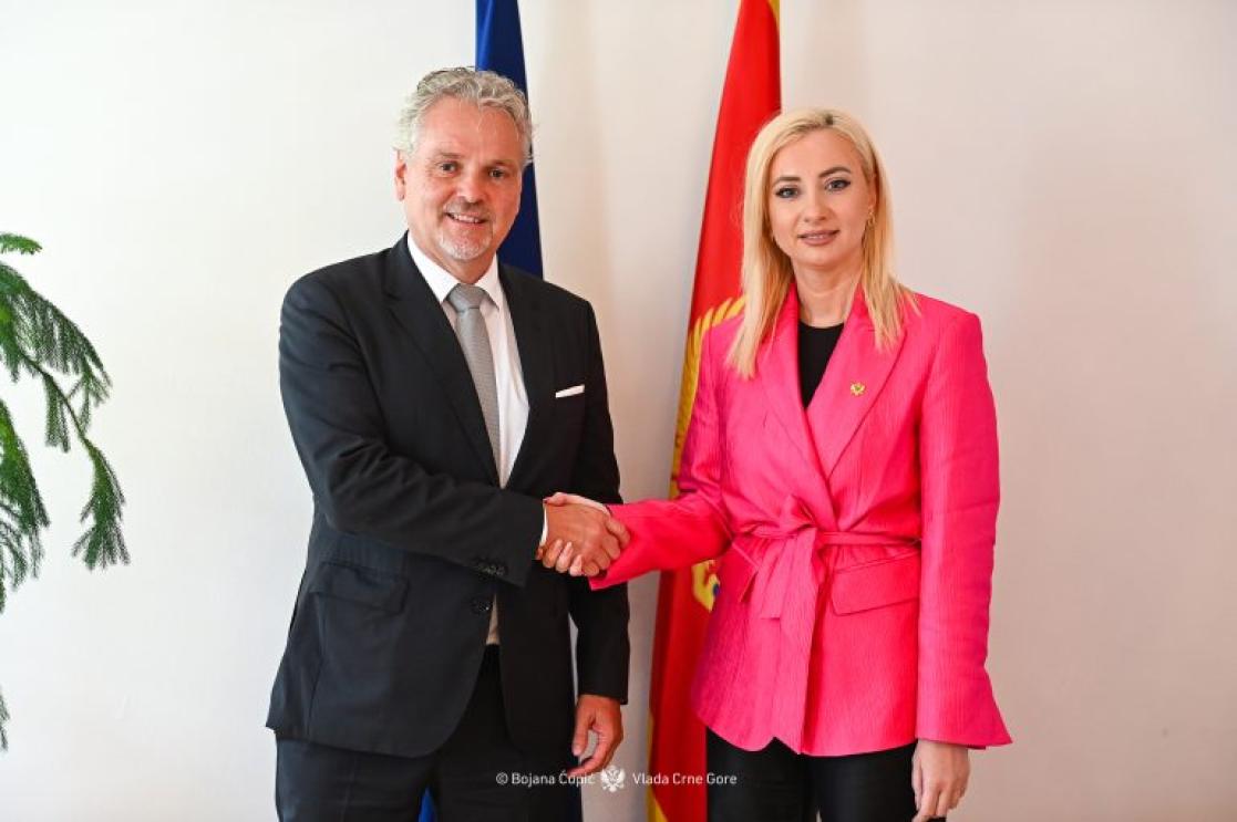 Ambassador Sattler shaking hands with Minister Gorčević