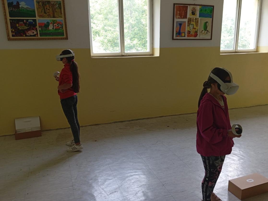 Two students standing in the hallway of "Lijeva Rijeka" school with VR SET on their heads