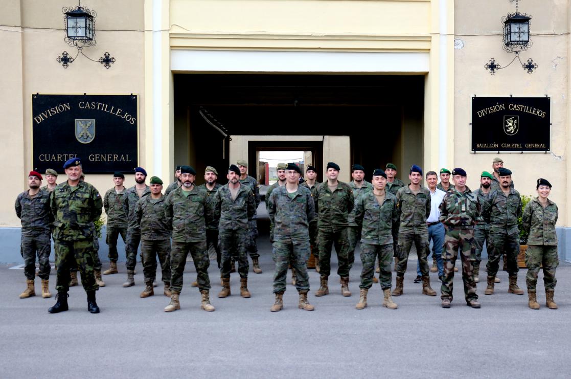 military staff standing in front of a building