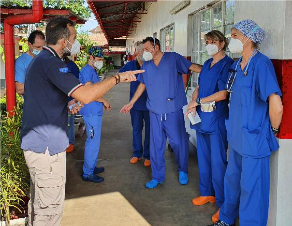 Group of medical personnel with medical masks speaking