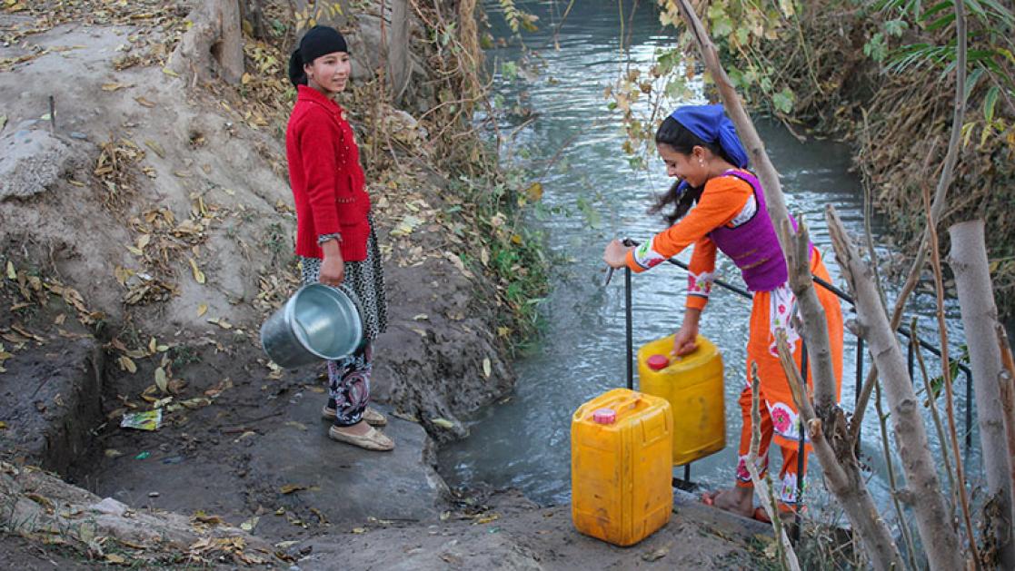Girls fetching water from a creek