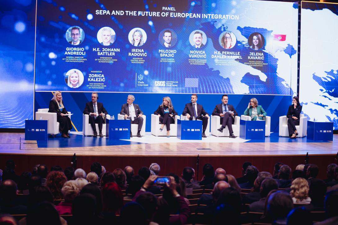 Group of people sitting on a stage