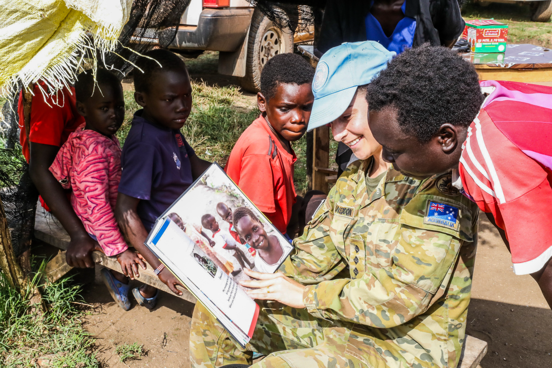 Female UN Peacekeeper with children