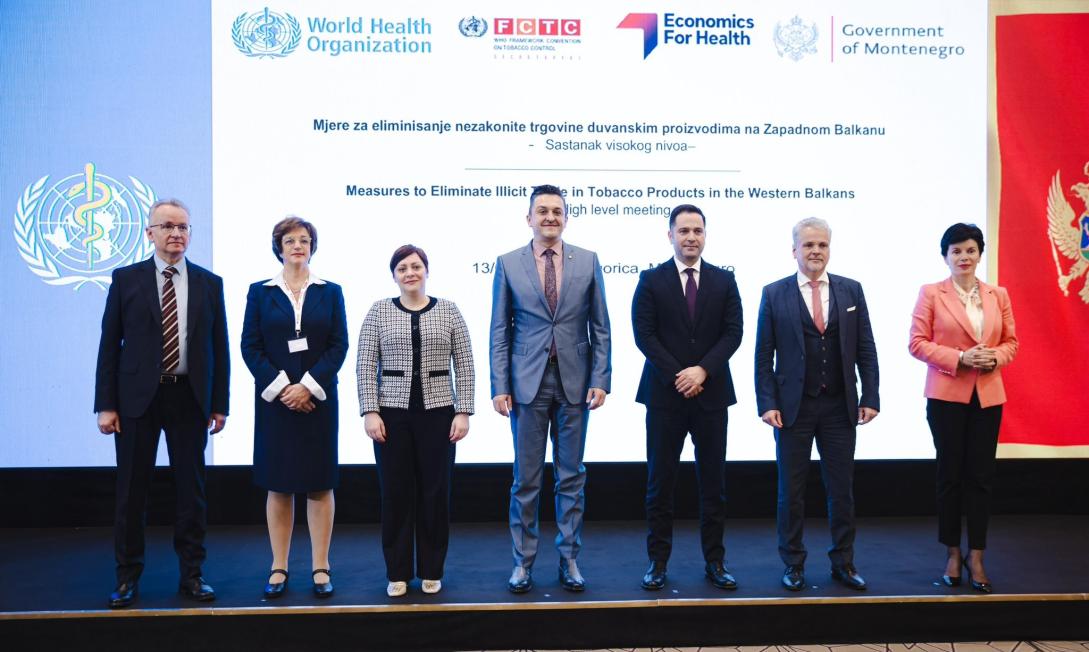 Officials standing on stage