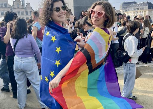 Two girsl with EU flag and Progress Pride flag