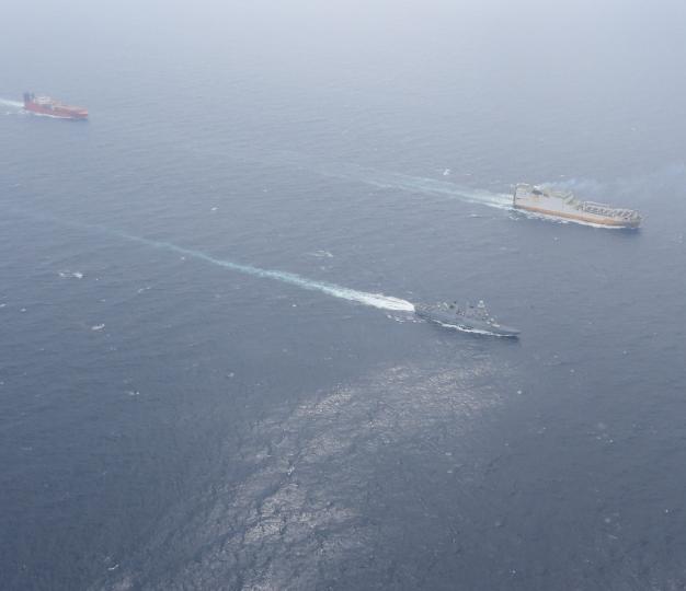 Two vessels and cargo ship further back